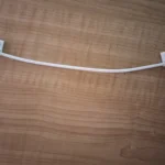 Cable-management clips installed under a cabinet