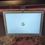 Google Nest Hub installed in an under-cabinet swivel mount
